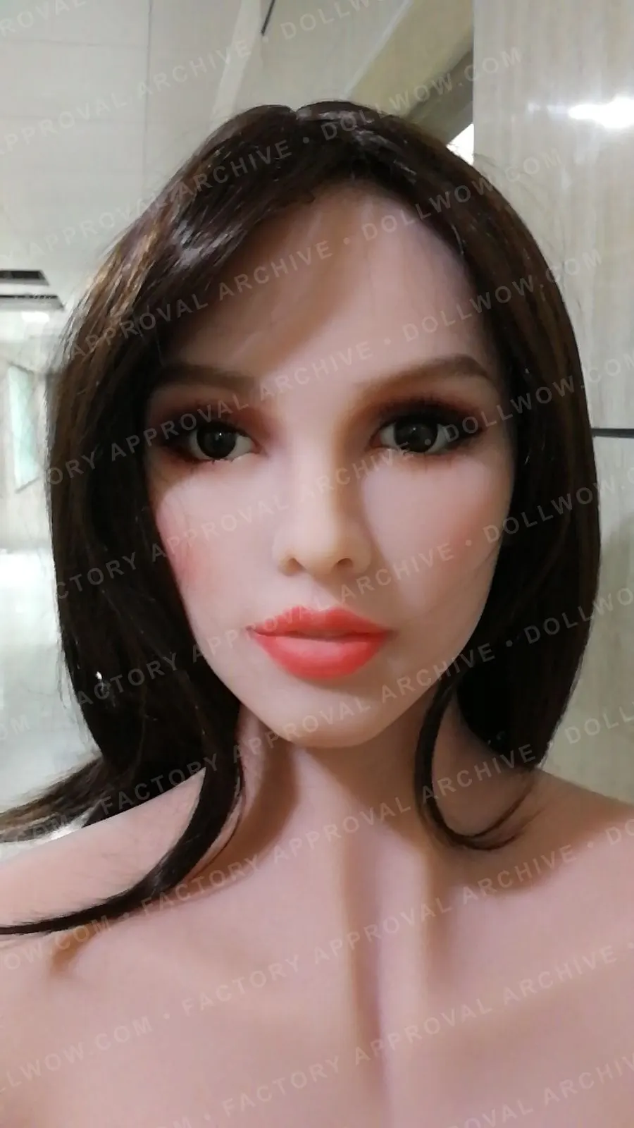 Anonymized factory photo showing a completed doll build for visible configuration review.